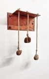3 Coins, 2024, rusted steel, rope, rocks, 17x12x14 inches