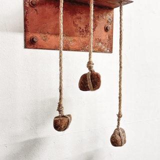 3 Coins, 2024, rusted steel, rope, rocks, 17x12x14 inches
